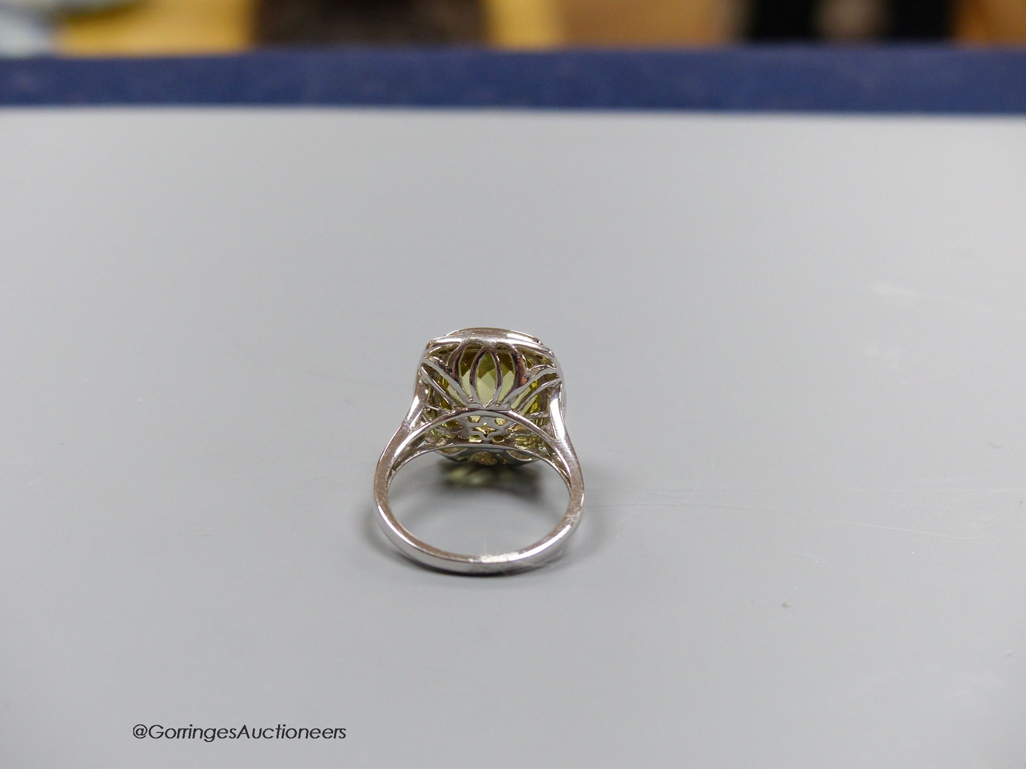 An 18ct white gold, diamond and lemon quartz cluster ring, size N, gross 7.3g.